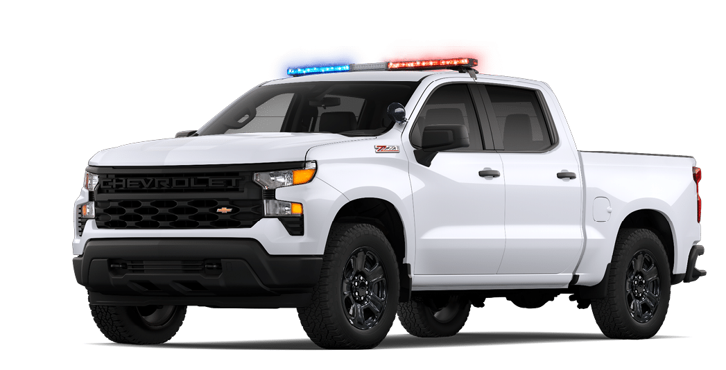 A white truck with a blue and red roof. Description generated by AI