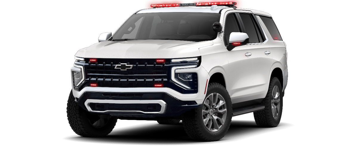 A white Chevy truck with red lights on the front. Description generated by AI