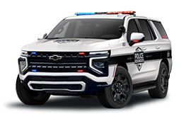 A white police vehicle with blue lights on top. Description generated by AI